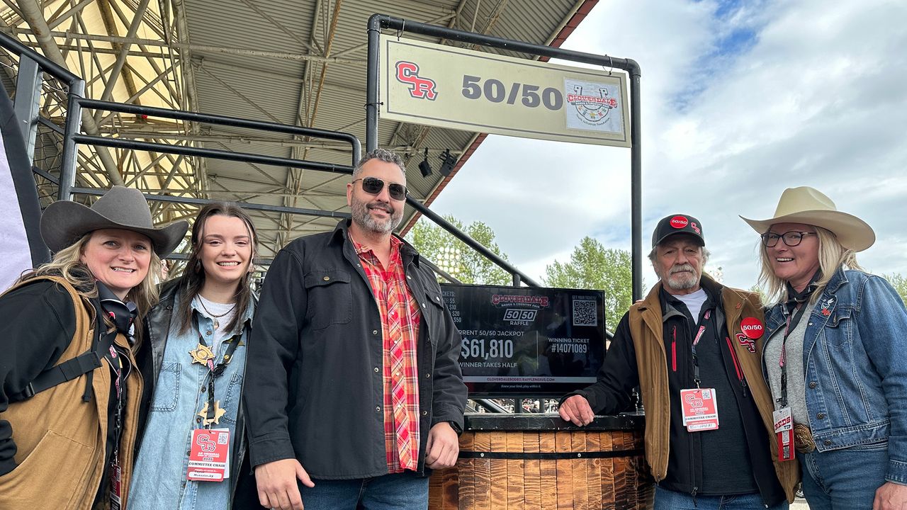 2025 Cloverdale Rodeo 50_50 winner accepting their prize on May 19th, 2025 - the total jackpot was $61,810