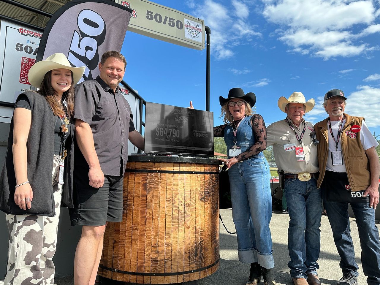 2025 Cloverdale Rodeo 50_50 winner accepting their prize on May 19th, 2025 - the total jackpot was $61,810