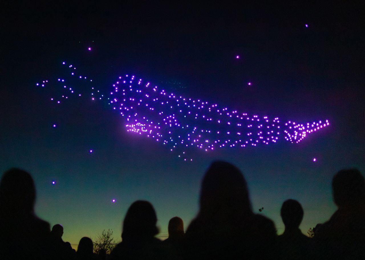 An image of people watching a drone show