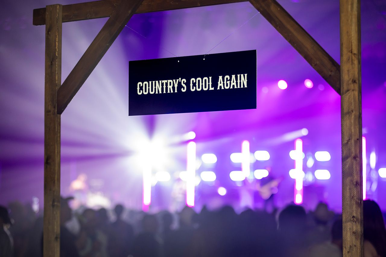 A sign on a Longhorn VIP suite - Country's Cool Again