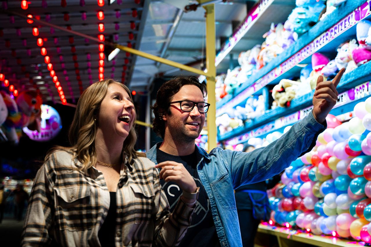 Couple choosing a prize at the Cloverdale Rodeo and Country Fair
