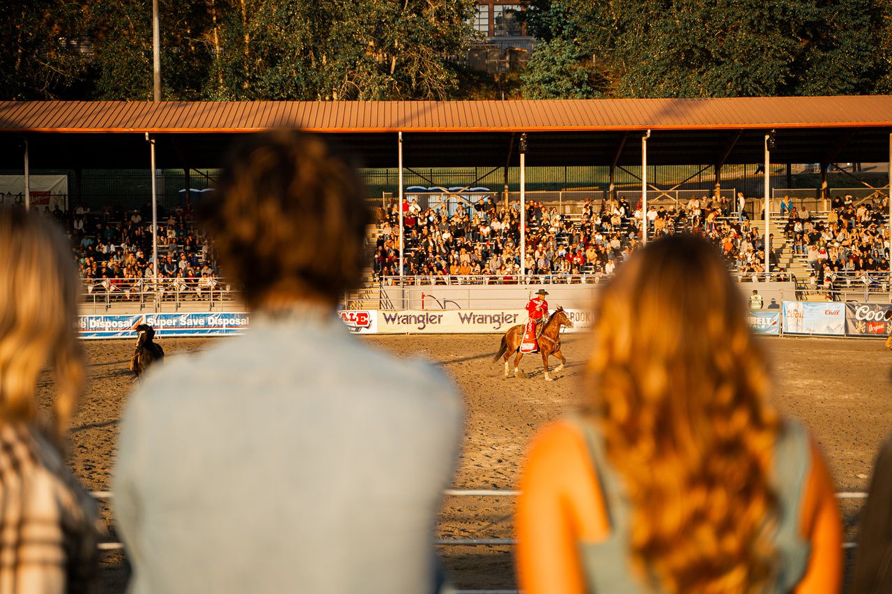 Rodeo models cheering for riders