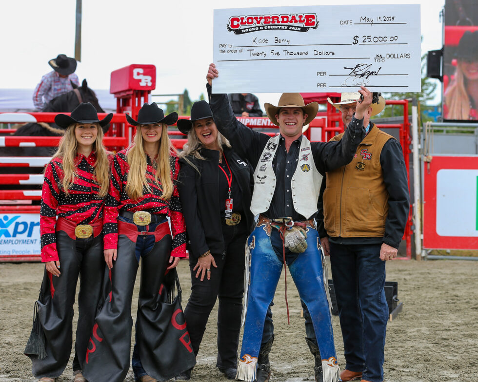 2025 Cloverdale Rodeo Bareback Champion Kade Berry holding the cheque