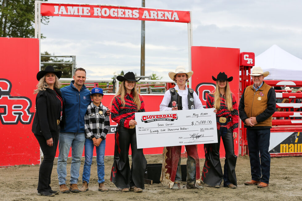 2025 Cloverdale Rodeo Bull Riding Champion Beau Gardner holding the champion's cheque